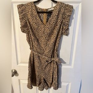NWT. Leopard print romper. Tag says Large, but runs like a medium.